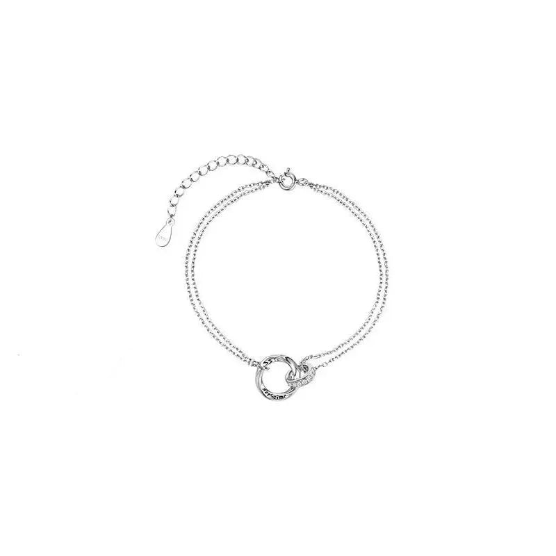 Exquisite couple bracelet with a pair of interlocking rings